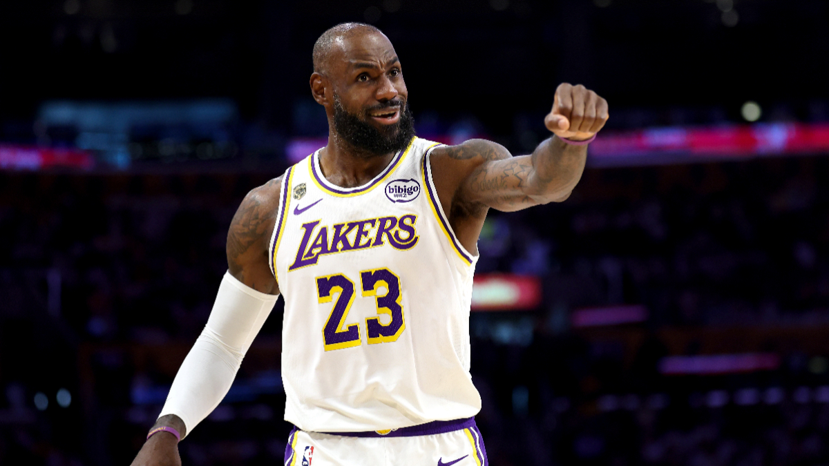 LeBron James gestures to fans during an NBA game
